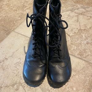 Dansko lace up heeled leather boots with stud details.